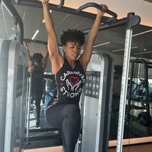 Load image into Gallery viewer, Brandee Evans working out in "Caregiver Strong" tank top.