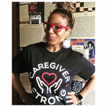 Load image into Gallery viewer, Advocate Dawnita Michelle&#39; Brown in her Caregiver Strong t-shirt.
