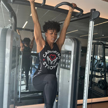 Load image into Gallery viewer, Brandee Evans working out in &quot;Caregiver Strong&quot; tank top.
